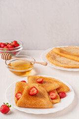 Homemade traditional thin folded crepe french dessert or sweet blini tasty snack made from batter...