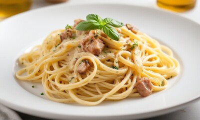 Creamy Pasta Dish with Fresh Basil Garnish on White Plate