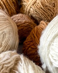 A pile of yarn with a variety of colors and textures