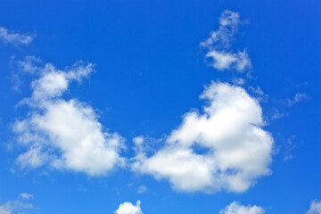 Blue sky background with white clouds. Nature summer background.