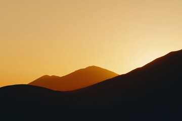 Obraz premium Misty mountain landscape at sunrise, golden light over the peaks, peaceful and breathtaking nature scenery, cinematic and ultra-HD quality