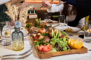 Indulge in an exquisite gourmet platter perfectly paired with a fine red wine selection