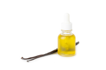 Bottle of vanilla essential oil with vanilla flower isolated on white background. aromatic vanilla beans. Vanilla extract. Spa concept. Beauty and care