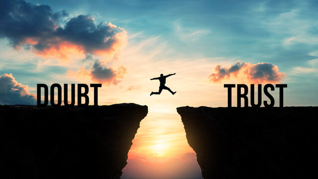 Silhouette of a person jumping from doubt to trust over a gap between cliffs at sunset, overcoming fear, building confidence, making a leap of faith, believing in oneself, achieving personal growth
