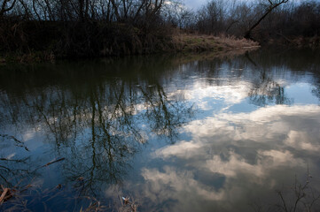 Evening over the lake, view of dark clouds moving with heavy rain.