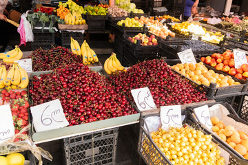 fruits and vegetables at the farmer's market, a counter with fresh fruits and vegetables