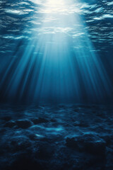 Obraz premium Deep ocean blue gradient background with subtle light rays illuminating underwater scene, creating serene and tranquil atmosphere