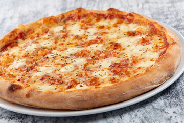 fresh pizza on the white plate