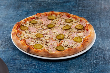 fresh pizza on the white plate