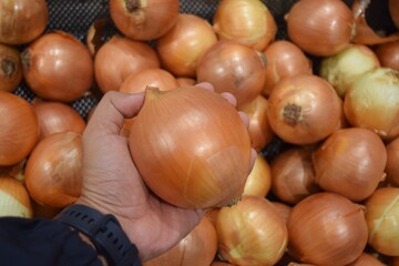 piles of fresh onions which are often used as a cooking spice