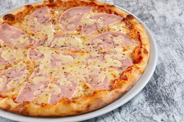 fresh pizza on the white plate