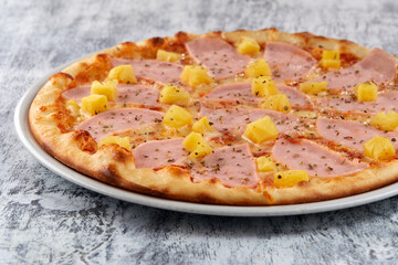 fresh pizza on the white plate