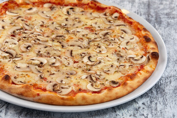 fresh pizza on the white plate