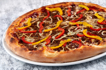 fresh pizza on the white plate