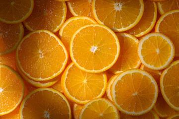 Vibrant orange slices arranged artistically in natural light, capturing bright freshness and deliciousness