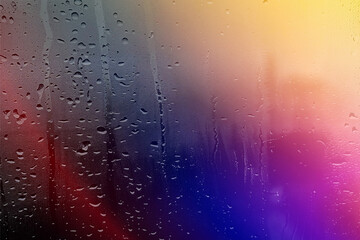 Obraz premium Raindrops on glass with abstract wet texture and blue liquid bubbles