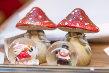 Unique Christmas decorations featuring snow globes and festive mushrooms