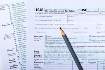 Individual income tax return form 1040. Tax payment and filing concept. Top view
