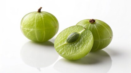 Close-up Still Life of Indian Gooseberries Two Whole and One Halved, White Background, Food Photography, amla, fruit amla, gooseberry