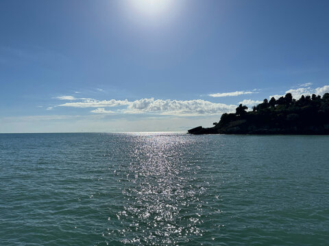 Beautiful sea, sun, sky and rocky coastline 