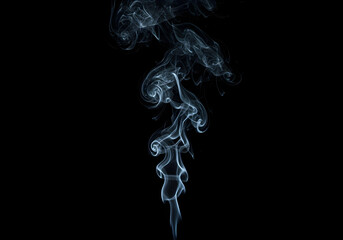 Smoke billows gracefully upwards in the dark atmosphere