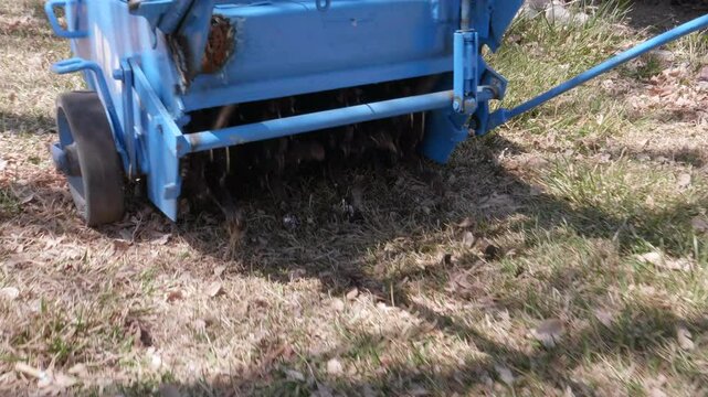 Aerator driving on lawn
