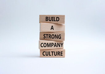 Company culture symbol. Wooden blocks with words Build a strong company culture. Beautiful white...