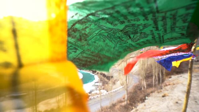 buddhist prayer flag waving in front of  Himalayas mountains. 