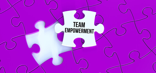 Fototapeta premium Team Empowerment text message on puzzle. White piece puzzle and purple background 3D rendering