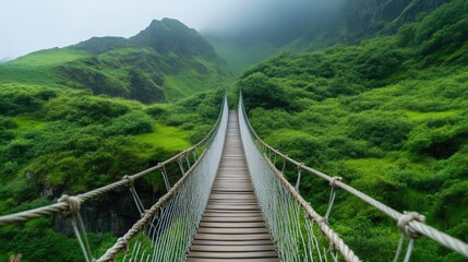 Obraz premium Trekking through a precarious rope bridge
