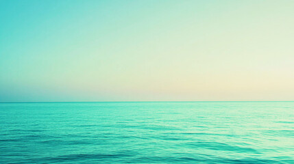 Obraz premium Serene turquoise and lime green gradient over calm water at dusk