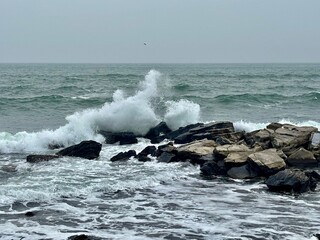 waves crashing on rocks