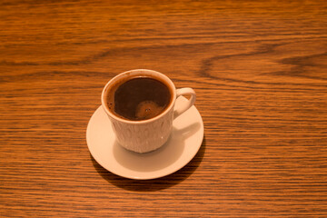 cup coffee in wooden background