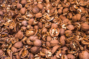 Scattered whole walnuts texture. Pattern, nuts background, texture close-up