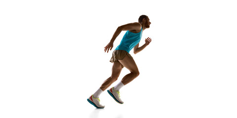 Runner accelerating forward, dynamic posture and strong physique emphasizing movement against white studio background. Concept of sport, speed, competition, and athletic performance.
