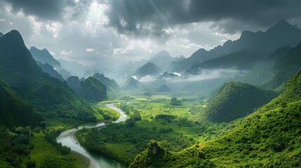 Fototapeta premium A vast verdant valley framed by towering misty mountains, where nature thrives under a dramatic sky.