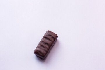 One piece of chocolate isolated on white.