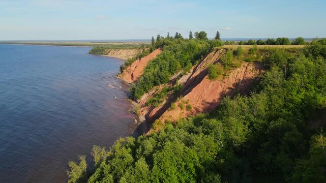 National Park nature Reserve in summer, canyon, large cliff stretching prima into the sky and water taken from a drone