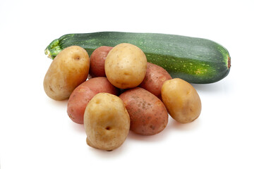 Fresh potatoes and zucchini isolated on white background

