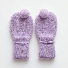 A pair of soft lavender hand-knitted mittens featuring pom-poms, perfect for winter warmth and a touch of handmade charm, isolated on a clean white studio background.