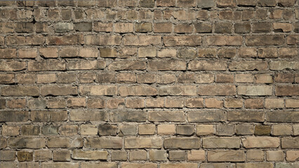 brick wall made of old brown bricks close up