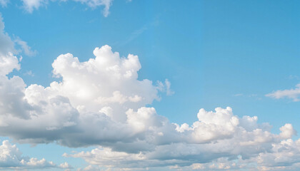 Fototapeta premium Serene white clouds drifting in blue sky, peaceful tranquility