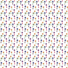 Colorful maracas background with long handle and round patterned top in bright shades.