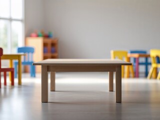 Empty wooden table on blurred background of kindergarten with big window and colorful furniture