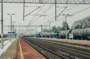 Obraz premium A snow-covered railway station in Eastern Europe, located in Poland.
