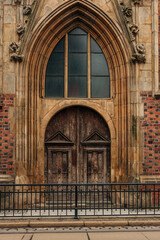 Fototapeta premium The grand church doors of a Gothic-style temple in Wroclaw, Poland