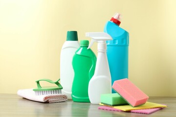 Many different house cleaning products on the table