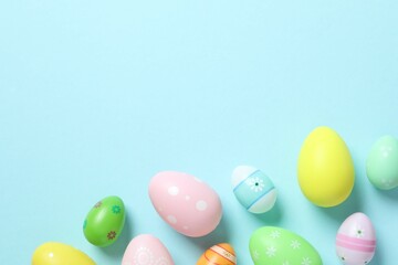 Happy Easter card. Easter eggs on color background, top view