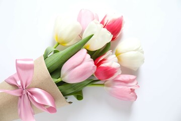 Beautiful fresh tulips on white background