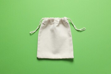 Small eco sack on color background. Top view.